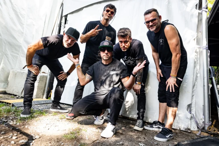 Band posing together backstage — Punchline 13, Vans Warped Tour Montreal 2026