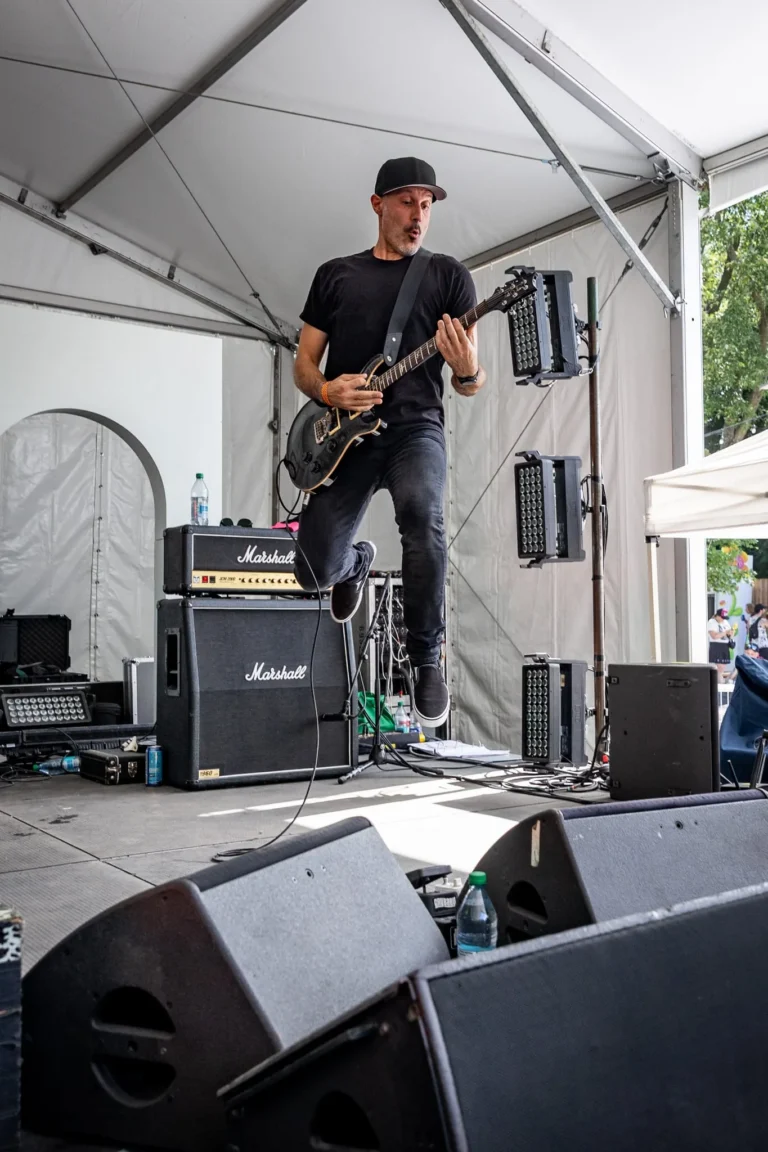 Guitarist performing on stage — Punchline 13, Vans Warped Tour Montreal 2026