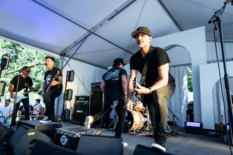 Band performing under stage lights — Punchline 13, Vans Warped Tour Montreal 2026